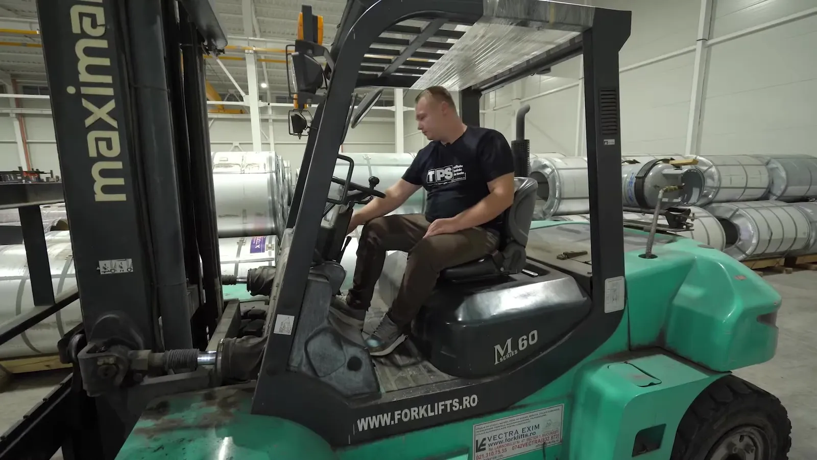 A forklift in the factory’s store of pre-painted steel coils