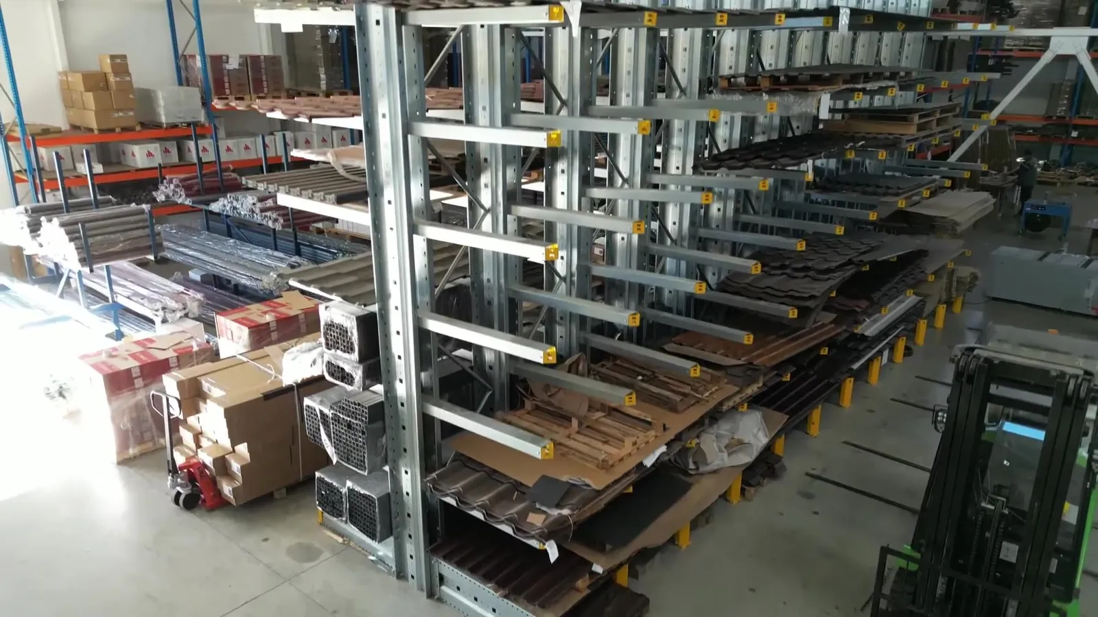 The TPS warehouse: racks of profiles, metal roof tiles and parcels ready to ship