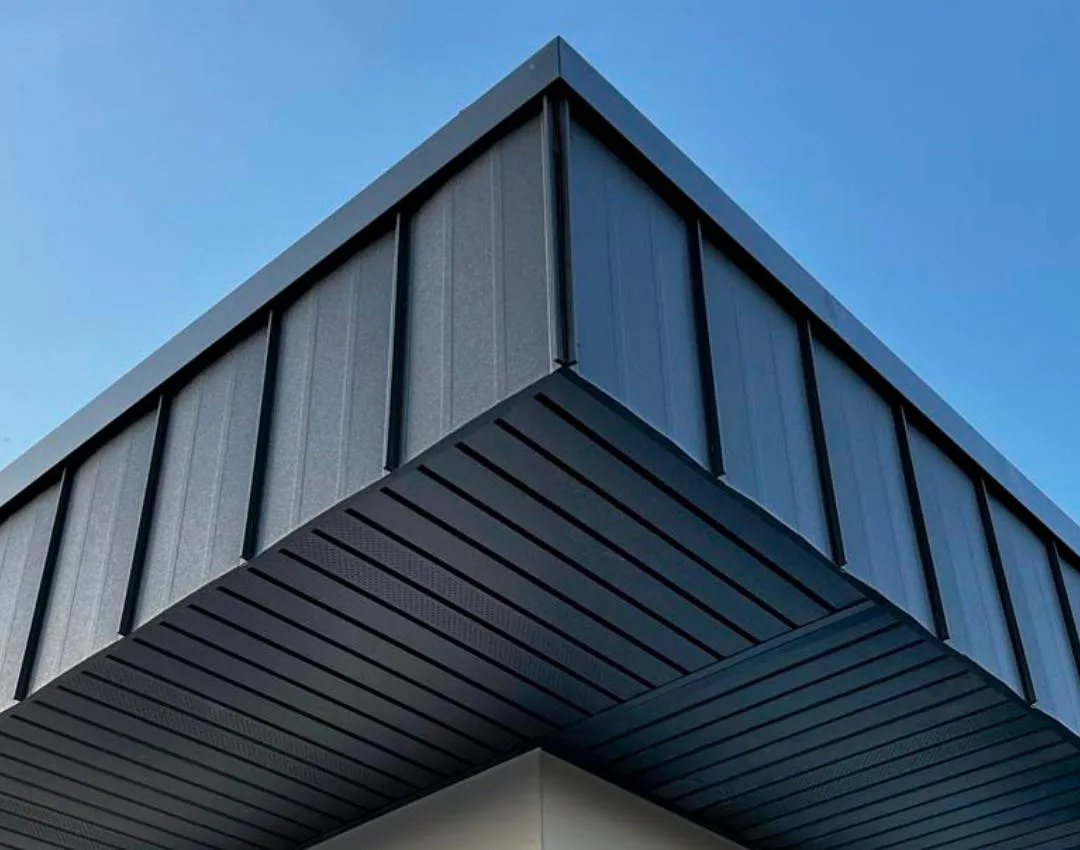 A soffit clad in grey metal cladding