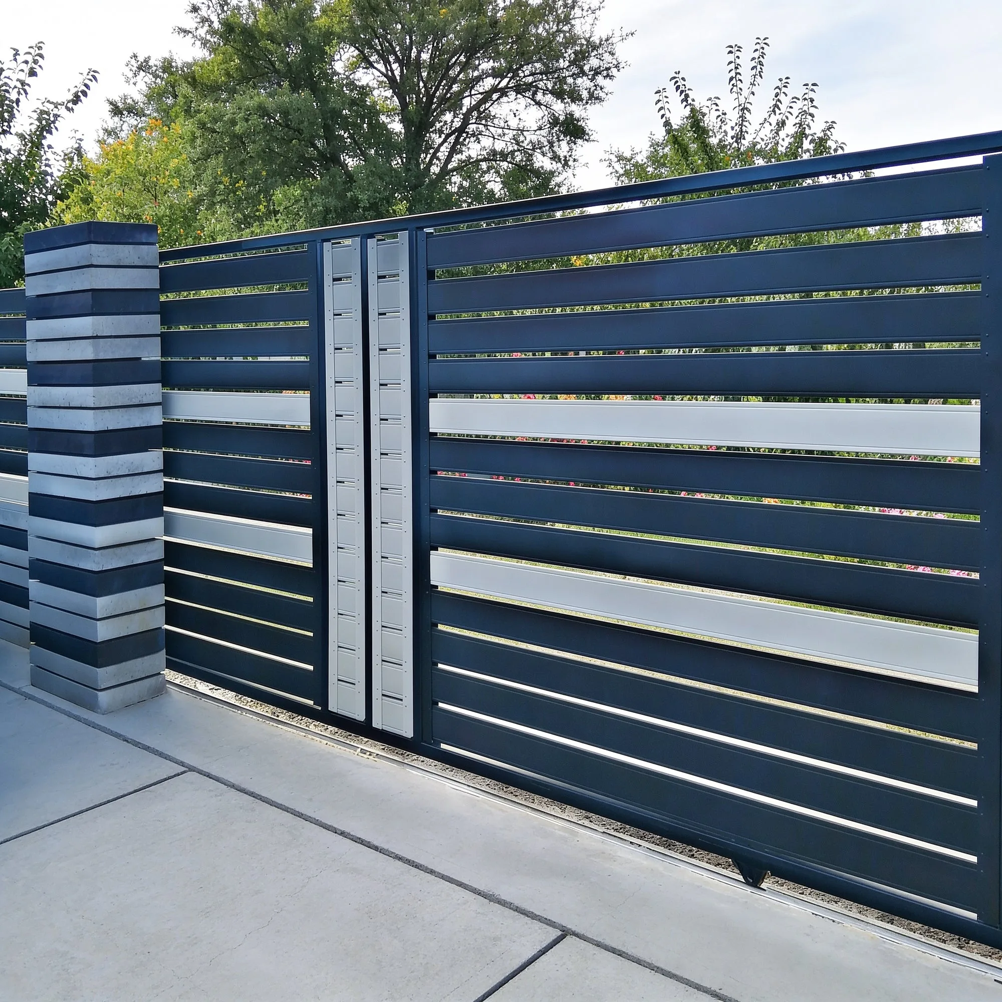 Anthracite Terra Pro sliding gate and fence with white slats